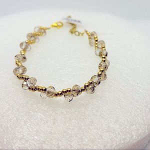 Bracelet golden and clear beads. Adorable!